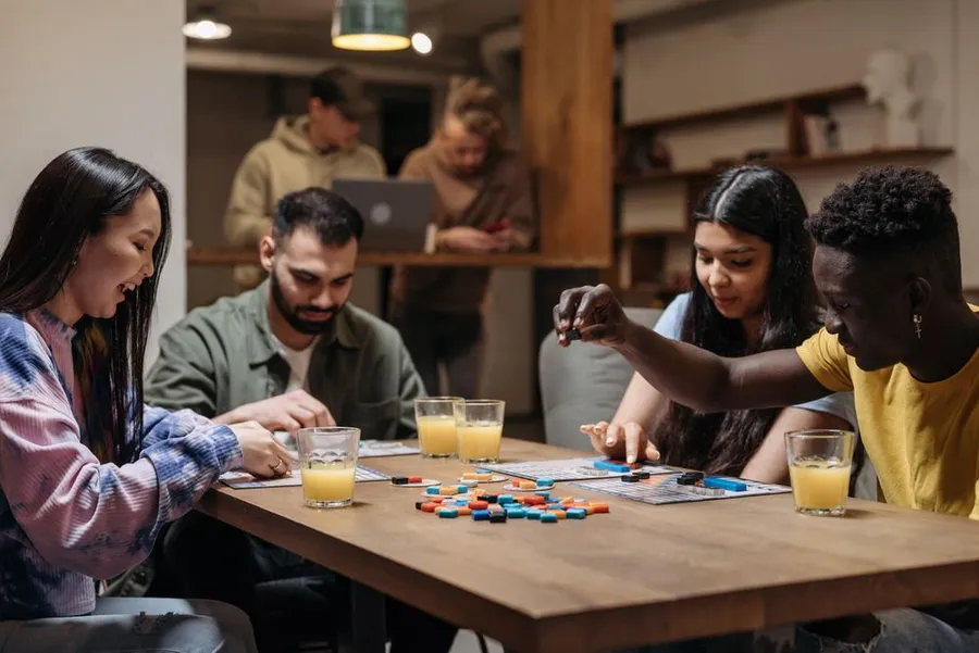 Friends playing a board game together